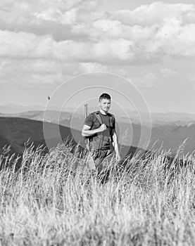 Soldier with rifle. Man with weapon military clothes in field nature background. Army forces. State border guard service