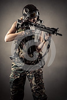 Soldier with rifle in studio shot