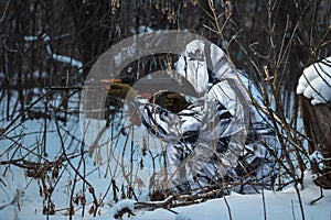 Soldier with the russian machine gun in snow