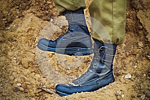 Soldier`s boots on the feet of an Israeli soldier. Concept: Soldiers IDF - Israel Defense Forces Tzahal, IsraelI soldiers photo