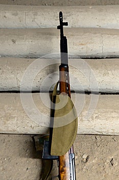 A soldier`s cap hangs on Tokarev`s self-loading rifle