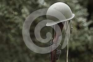 Soldier`s Helmet And Rifle