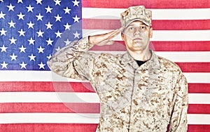 Soldier saluting to national flag of United States