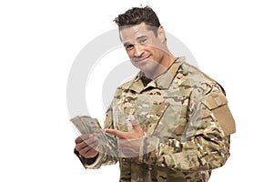 Soldier showing money