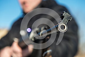 Soldier or sniper holding gun with virtual screen projection and
