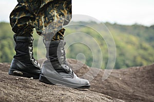 Soldier stand on the rock in nature