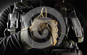 Soldier in tactical gloves showing like front view closeup