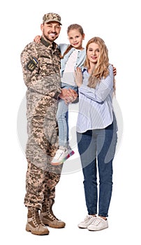 Soldier in Ukrainian military uniform reunited with his family on white background