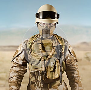 Soldier in uniform standing in desert