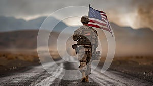 Soldier walks with US flag on road, under sky, in landscape