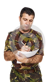 Soldier who writes something on paper