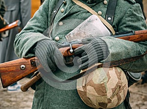 Soldier in winter uniform with a rifle in his hands