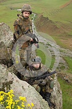 Soldiers in ammunitionon the cliff