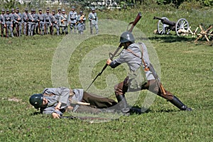 Soldiers in attack position simulating a kill action