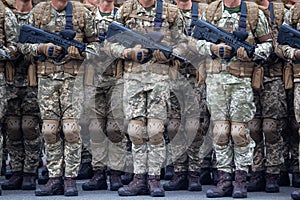 Soldiers with automatic rifles in the ranks