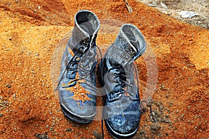 Soldiers boots of the army of Israel in dust on the sand. Concept: Soldiers Tzahal IDF - Israel Defense Forces photo