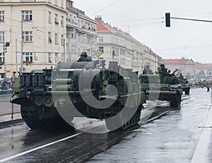 Soldiers of Czech Army are riding armoured recovery vehicle on military parade