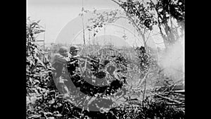 Soldiers firing into bushes, 1940s