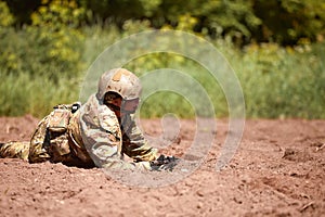 Soldiers game on military training ground battle camp. Action. Operation Trainer giving training to military soldiers at