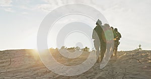 Soldiers marching on sand, field exercises, training ground, surveillance, patrolling the area, camouflage moro, ghouls