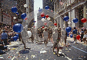 Soldiers marching in ticker tape parade, NY