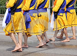 Soldiers with orange clothes march through the city during a fes