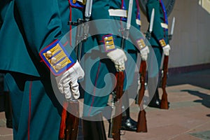 Soldiers in parade uniform with rifles