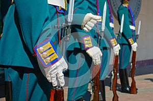 Soldiers in parade uniform with rifles