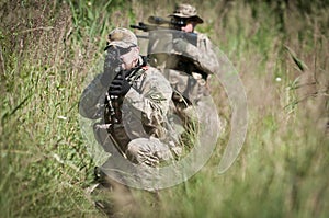 Soldiers on patrol hiding
