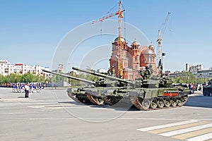 Soldiers ride an army tanks during a dress rehearsal of a military parade in honor of Victory Day in Volgograd