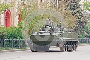 Soldiers ride on BMP-3 infantry fighting vehicle during a dress rehearsal of a military parade in honor of Victory Day in Volgogra