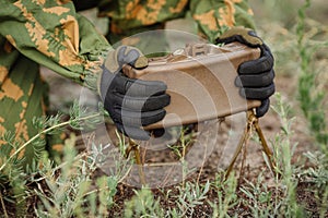 Soldiers set mine in the grass