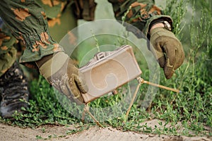 Soldiers set mine in the grass photo