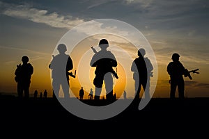 Soldiers silhouettes in sunsets sentinels resonate under evening glow