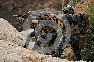 Soldiers in special forces, Army soldier in protective combat uniform posing, looking at side