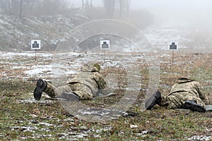 Soldiers in the training of shooting at the site are aimed fire at targets