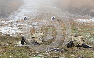 Soldiers in the training of shooting at the site are aimed fire at targets