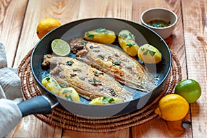 Sole flatfish cooked on a pan, portion for two