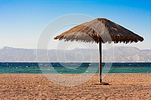 Sole sunshade on a beach photo