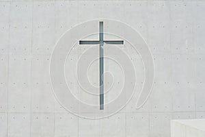 Solemn church with raw concrete, architectural concrete, exposed concrete cross photo