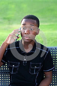 Black Teen Boy Talking on his cell phone