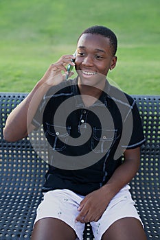 Black Teen Boy Talking on his cell phone