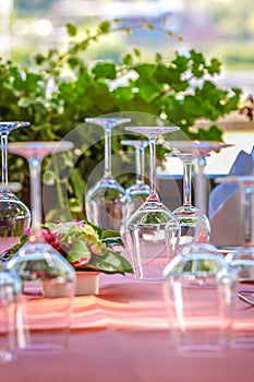 Solemnly laid table with wine glasses