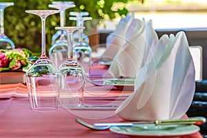 Solemnly laid table with wine glasses