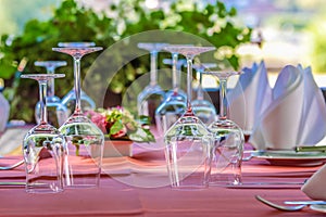 Solemnly laid table with wine glasses