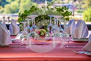 Solemnly laid table with wine glasses