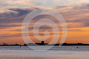 Solhouette of an old coastal fort at sunset