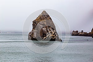 Solid as the rock; or tip of the iceberg, view of a large rock in the Bay