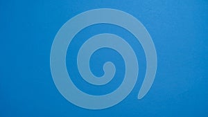 Solid bright blue background texture for abstract design and graphic elements