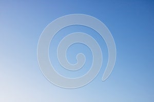 Solid color bright blue sky, background or texture